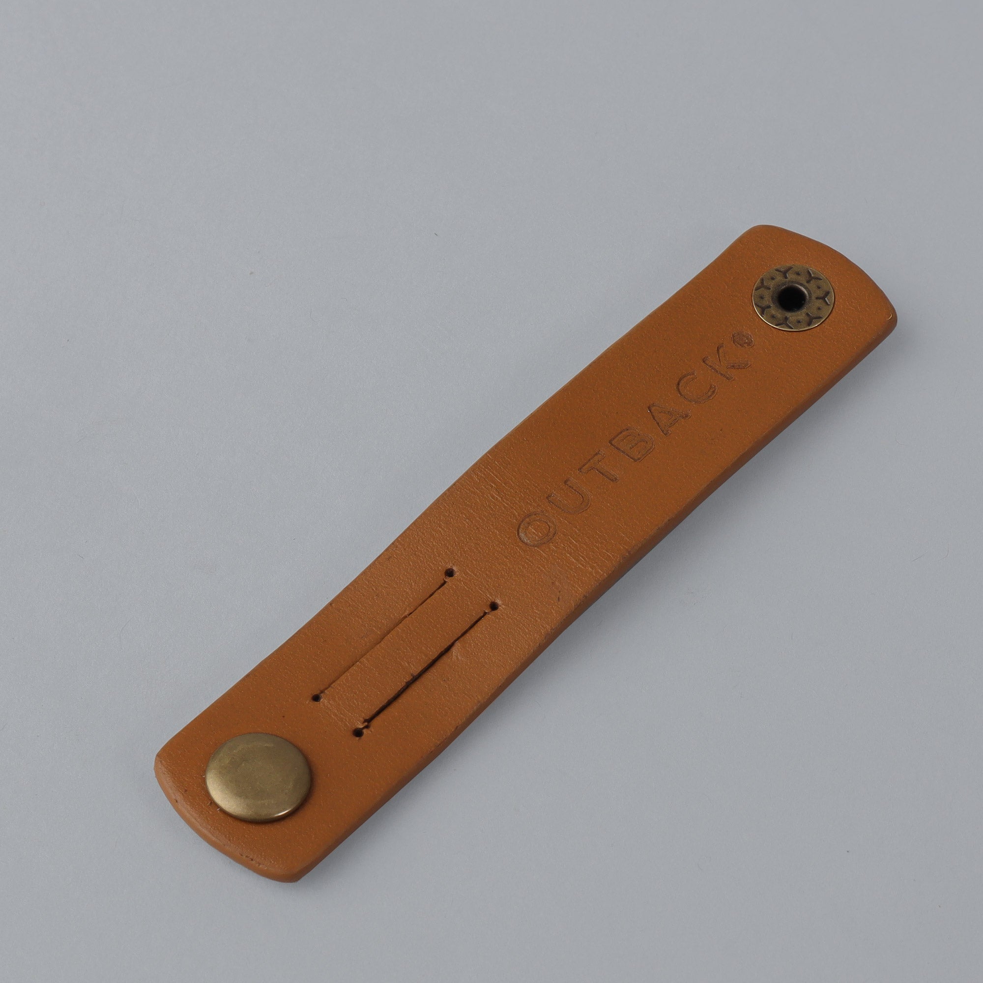 Tan leather cable wrap organizer 