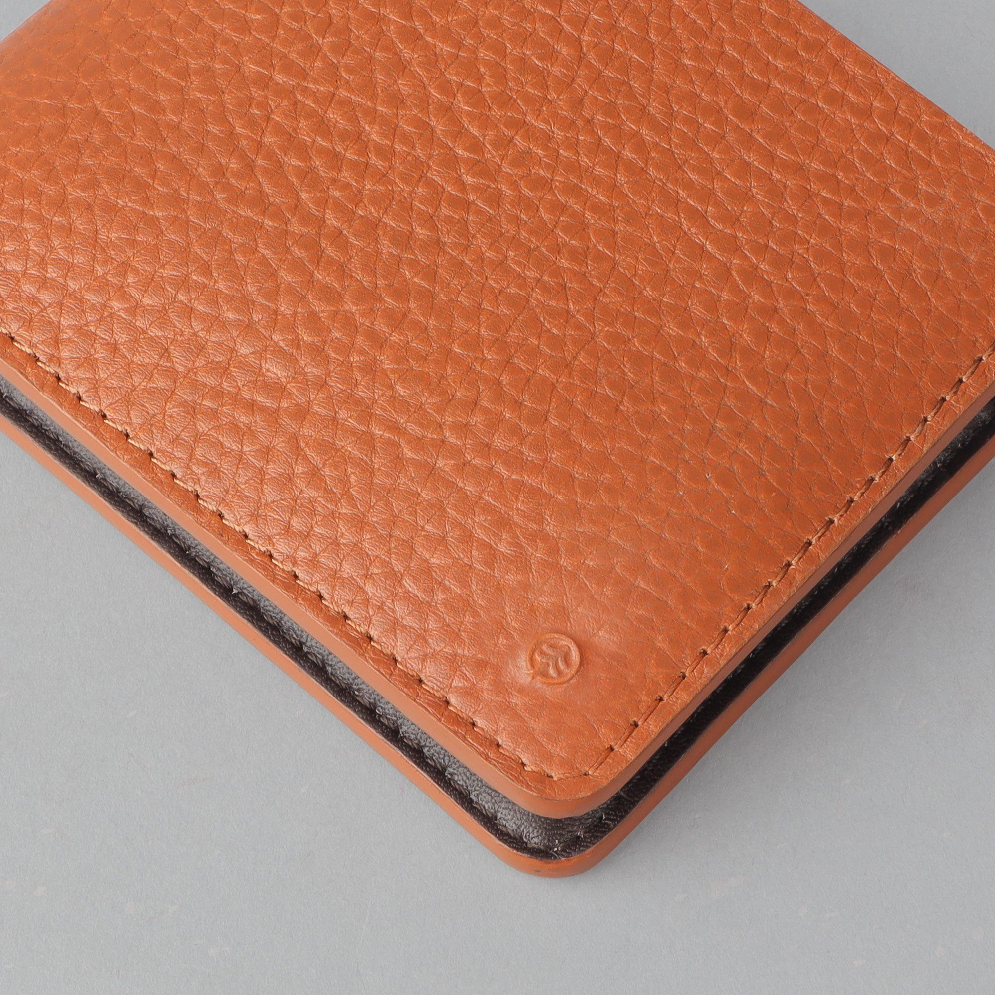 Tan leather bi-fold wallet